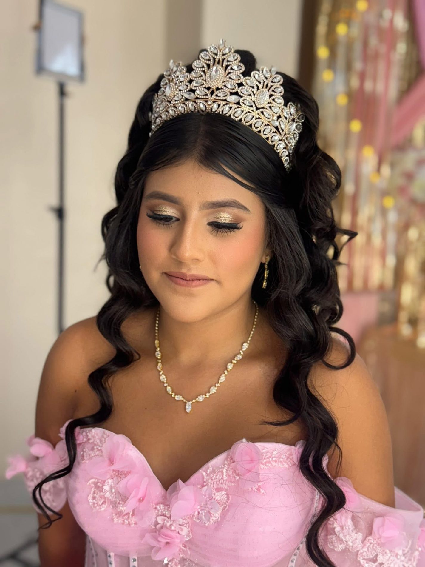 Quinceañera makeup with jeweled crown